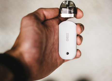 hand holding vaping device